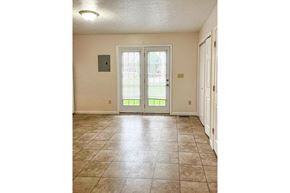 Gosport apartment for rent - a living room with a door and a tile floor