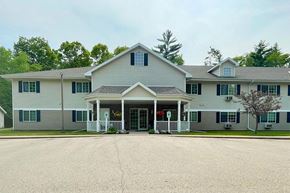 Black River Falls apartment for rent - a large white house with a porch and a driveway