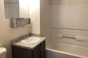 Newton apartment for rent - a bathroom with a sink and a bath tub