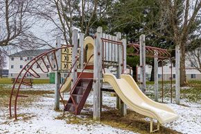 Stevens Point apartment for rent - A playground with a slide and a climbing frame.