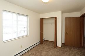 Stevens Point apartment for rent - a bedroom with a large window and a closet