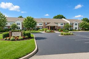 Nicholasville apartment for rent - The image shows a beautiful day at the Creekside Seniors apartment complex.