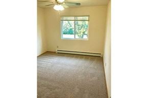 Appleton apartment for rent - an empty bedroom with a window and a ceiling fan