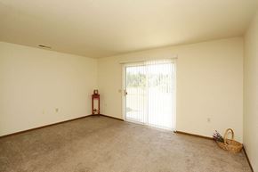 Gaylord apartment for rent - an empty living room with a sliding glass door