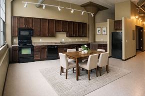Davenport apartment for rent - A kitchen with a table and chairs in the middle of the room.