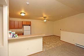 Fond Du Lac apartment for rent - A kitchen area with a counter and a refrigerator.