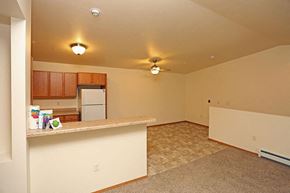 Fond Du Lac apartment for rent - A kitchen area with a counter and a refrigerator.