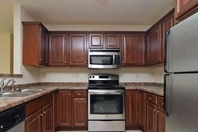 Little Chute apartment for rent - a kitchen with a stove microwave and sink
