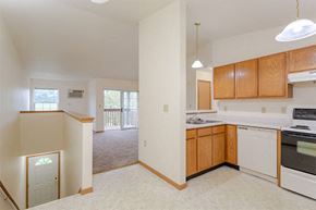 Milton apartment for rent - an empty kitchen with an empty living room