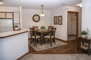 Hutchinson apartment for rent - A dining room with a table set for four.