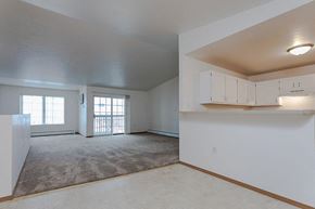 Ripon apartment for rent - an empty living room with white cabinets and a door