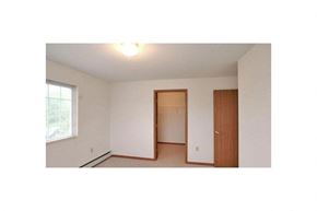 Howard apartment for rent - an empty bedroom with a door to a closet