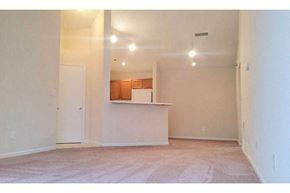 Hurricane apartment for rent - an empty living room with a kitchen in it