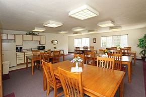 Stevens Point apartment for rent - a dining room with wooden tables and chairs