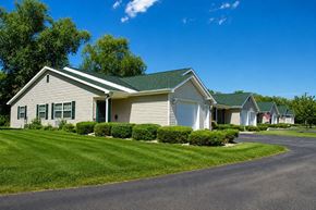 Fond Du Lac apartment for rent - A row of houses with green roofs and white walls.