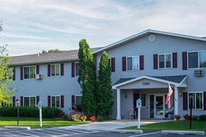 Green Bay apartment for rent - a white building with an flag in front of it