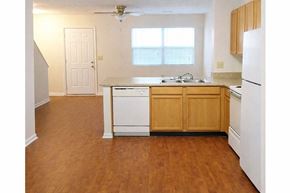 Nicholasville apartment for rent - A kitchen with wooden floors and white appliances.