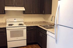 Newton apartment for rent - a kitchen with a stove refrigerator and a sink