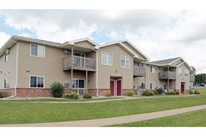Platteville apartment for rent - an apartment building with two stories and a red door