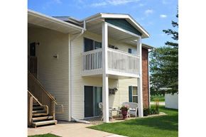 Galesburg apartment for rent - A two-story house with a balcony on the second floor.