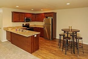 Mukwonago apartment for rent - a kitchen with a bar and a table