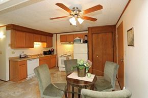 Wisconsin Rapids apartment for rent - A kitchen with a table and chairs in the middle of the room.