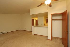 Appleton apartment for rent - A room with a ceiling fan and a door.