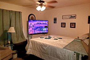 Neenah apartment for rent - a bedroom with a bed and a tv in it