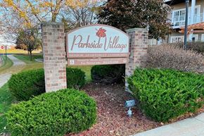 Hartford apartment for rent - a village sign in front of a building
