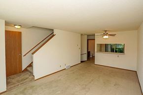 Hartland apartment for rent - A room with a carpeted floor and a ceiling fan.