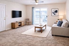 Henderson apartment for rent - A living room with a flat screen TV mounted on the wall.