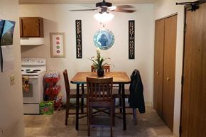 Neenah apartment for rent - a dining room with a wooden table and chairs