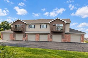 Grafton apartment for rent - A two-story house with a balcony on the second floor.