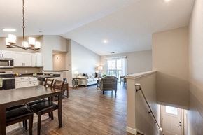 Hugo apartment for rent - a living room with a kitchen and a dining room