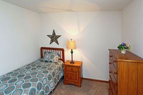 Beaver Dam apartment for rent - a small bedroom with a bed and a dresser