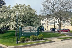 South Milwaukee apartment for rent - Sunrise Village sign in front of a building.