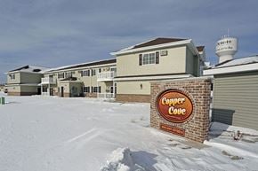 Oconto apartment for rent - a condo condo building with a sign in the snow