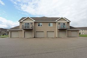 Fond Du Lac apartment for rent - a large house with many garage doors