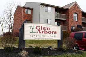 Napoleon apartment for rent - a sign for glen abbots apartment homes in front of a building
