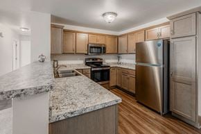 Plover apartment for rent - A kitchen with a granite counter top and stainless steel appliances.