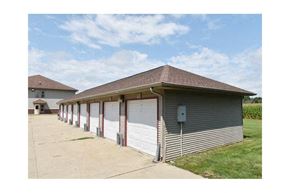 Mahomet apartment for rent - a building with a row of garage doors