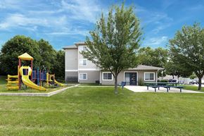 Le Claire apartment for rent - a yard with a playground and a house