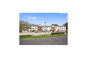 Marinette apartment for rent - a large building with a street in front of it