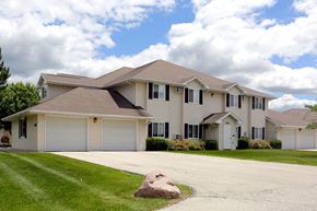 Green Bay apartment for rent - A large house with a driveway in front.