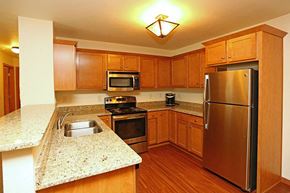 Hartland apartment for rent - a kitchen with stainless steel appliances and granite counter tops