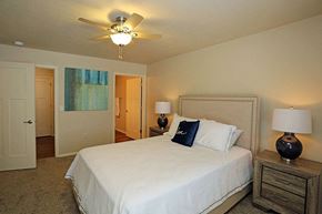 Hartford apartment for rent - a bedroom with a large white bed and a ceiling fan