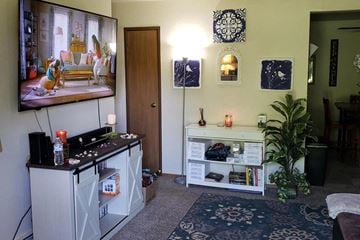 Neenah apartment for rent - a living room with a television and a table