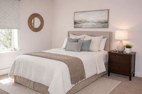 Clear Lake apartment for rent - A bedroom with a large bed and a painting on the wall.
