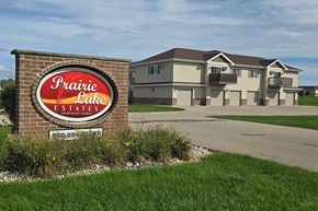 Neenah apartment for rent - A sign for Prairie Lake Estates in front of a building.
