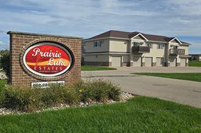 Neenah apartment for rent - A sign for Prairie Lake Estates in front of a building.